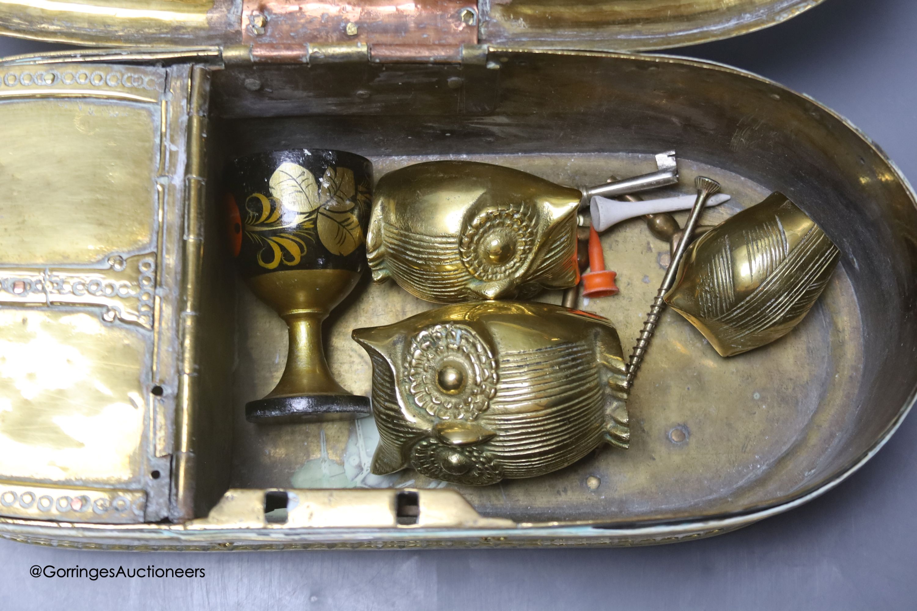 An Eastern brass lidded box, 33cm wide.